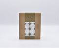 brown cardboard box packaging; window showing white tealights; black text and symbols on packaging; product labelled with 9 hours burn time; pack contains multiple tealight candles;