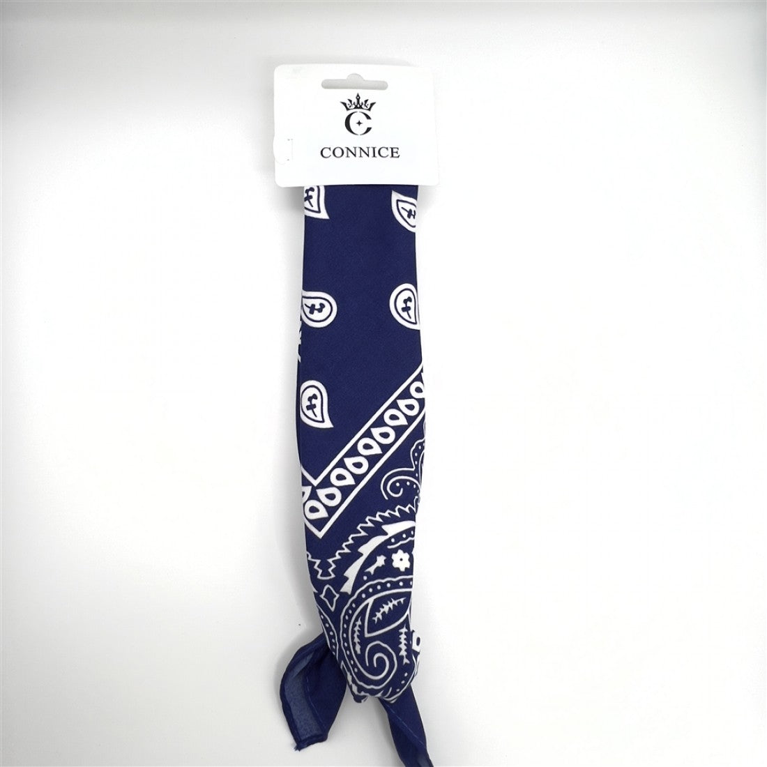 Navy blue fabric with white paisley pattern; Long rectangular bandana shape; Tied knot at one end; Cardboard hanger with Connice branding at the top;