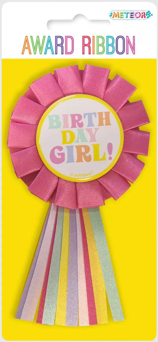 Pastel pink rosette ribbon; Multicoloured vertical ribbon tails; 'BIRTH DAY GIRL!' text in multicolour; Yellow backing card with 'AWARD RIBBON' text;