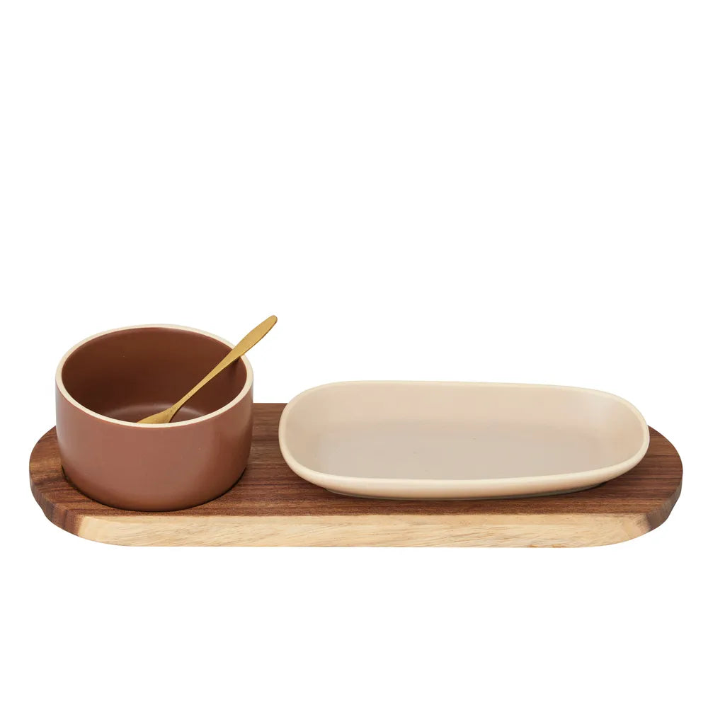 natural wood serving board; brown ceramic bowl; beige rectangular ceramic plate; gold-coloured small spoon;