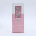 pink coloured tealights; pack of 10 candles; rectangular box with window display; white and pink colour packaging; silver text and logo on packaging;