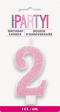 pink glitter number 2 shape; white candle base; approximately 8cm size; packaged on white backing card; single candle in pack;