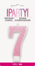 Pink numeral 7 shape; Glitter finish on candle; Candle on white backing card; Packaging with Unique Party branding;