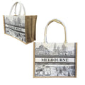 natural jute-like material sides; white fabric handles; rectangular shape; black and white Melbourne cityscape print; reinforced edges;
