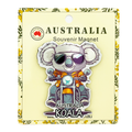 PVC magnet shaped like a koala; Koala wearing sunglasses and orange jacket; Koala riding a motorbike; Yellow card backing with floral edge design; Text on magnet reads 'AUSTRALIA KOALA';