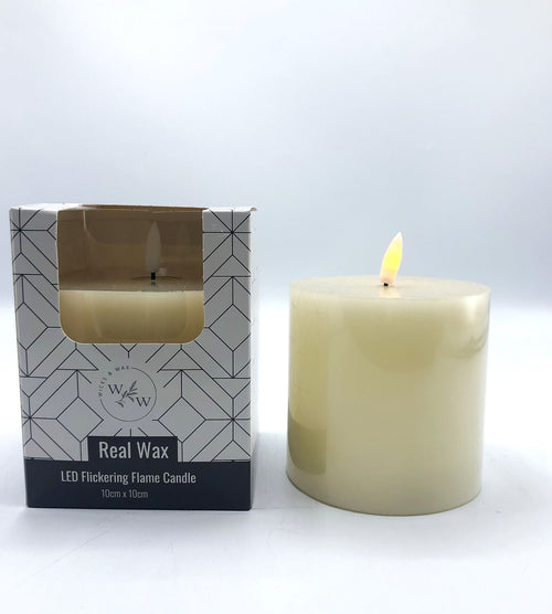 cream coloured real wax candle; cylindrical pillar shape; approximately 10cm diameter and height; flickering LED flame; packaged in white box with black geometric design;