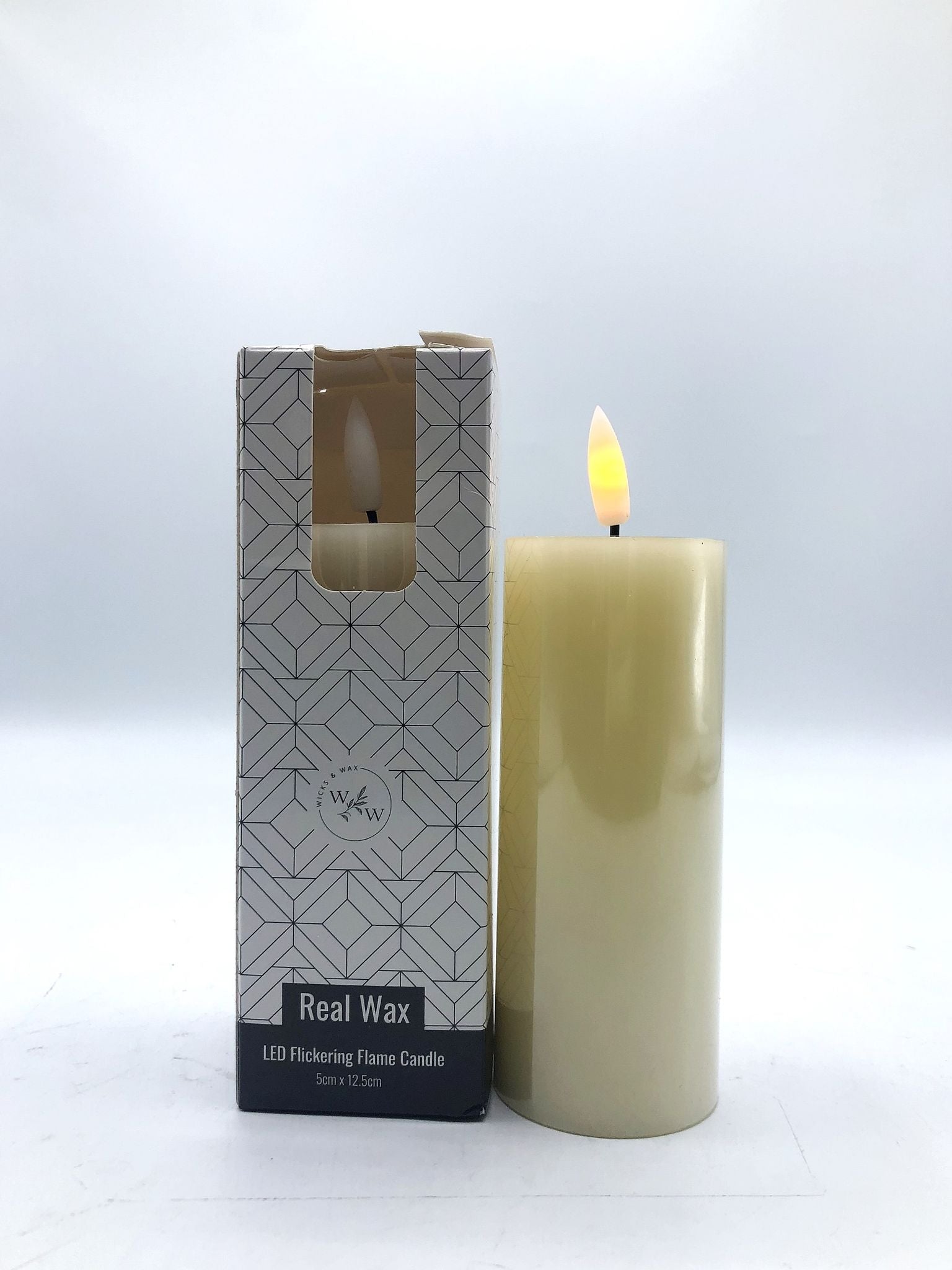 Cream/off-white colour; Pillar shape; Real wax outer coating; Flickering LED flame on top; Box with geometric design;