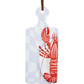 rectangular shape with handle; white ceramic surface; red lobster print design; cork base; blue circle detail on ceramic top;
