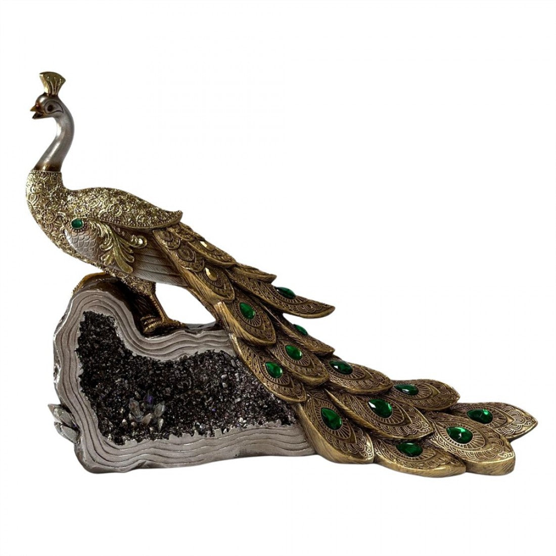 Gold-toned peacock figurine with detailed feather pattern; Green jewel-like accents on tail feathers; Peacock perched on a rock-style base; Base features dark, crystal-like textured section;