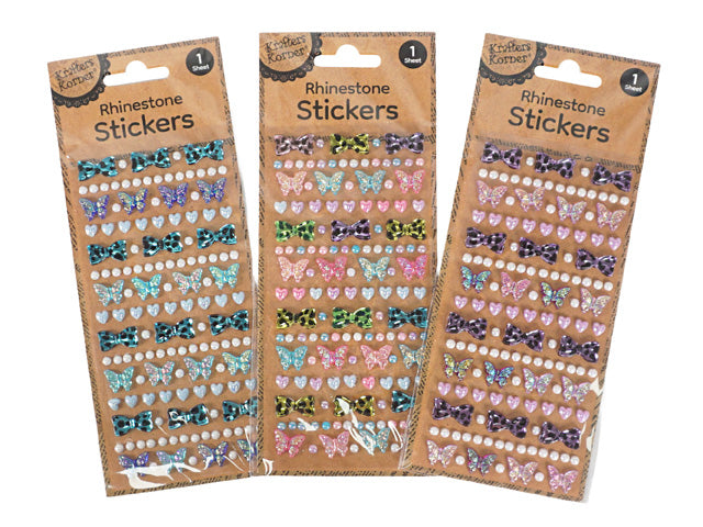 assorted colours including blue, pink, purple and green; shapes include bows, butterflies, hearts and round rhinestones; rhinestone style with shiny, gem-like appearance; single sheet packaging with kraft card backing;