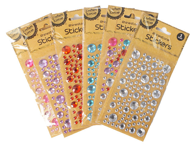 pack of rhinestone stickers; assorted colours: clear, red, blue, pink, purple; various sizes of round gems; kraft paper backing with clear plastic cover; single pack with hang hole;
