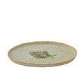 Ivory coloured ceramic plate; Green fish motif in centre; Irregular rounded shape; Glazed ceramic surface;