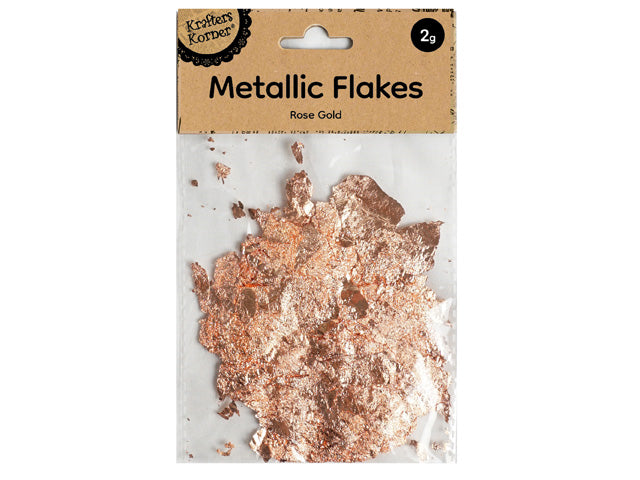 Rose gold colour flakes; Transparent plastic packaging; Brown kraft paper label; Brand name: Krafters Korner; 2g weight marked on label;