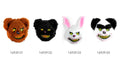 White fluffy face covering; Two upright ears with pink inner sections; Bright green eyes; Wide grin with pointed teeth;
