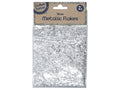 silver metallic flakes; clear resealable plastic bag; kraft paper label with text; 2g quantity indicated;