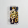 Pack of multiple small elastic hair ties; Mix of neutral colours including beige, brown and mustard tones; Soft, fabric-covered finish on each tie; Supplied in a clear rectangular plastic case with flip lid; Gold circular logo printed on the front of the case;
