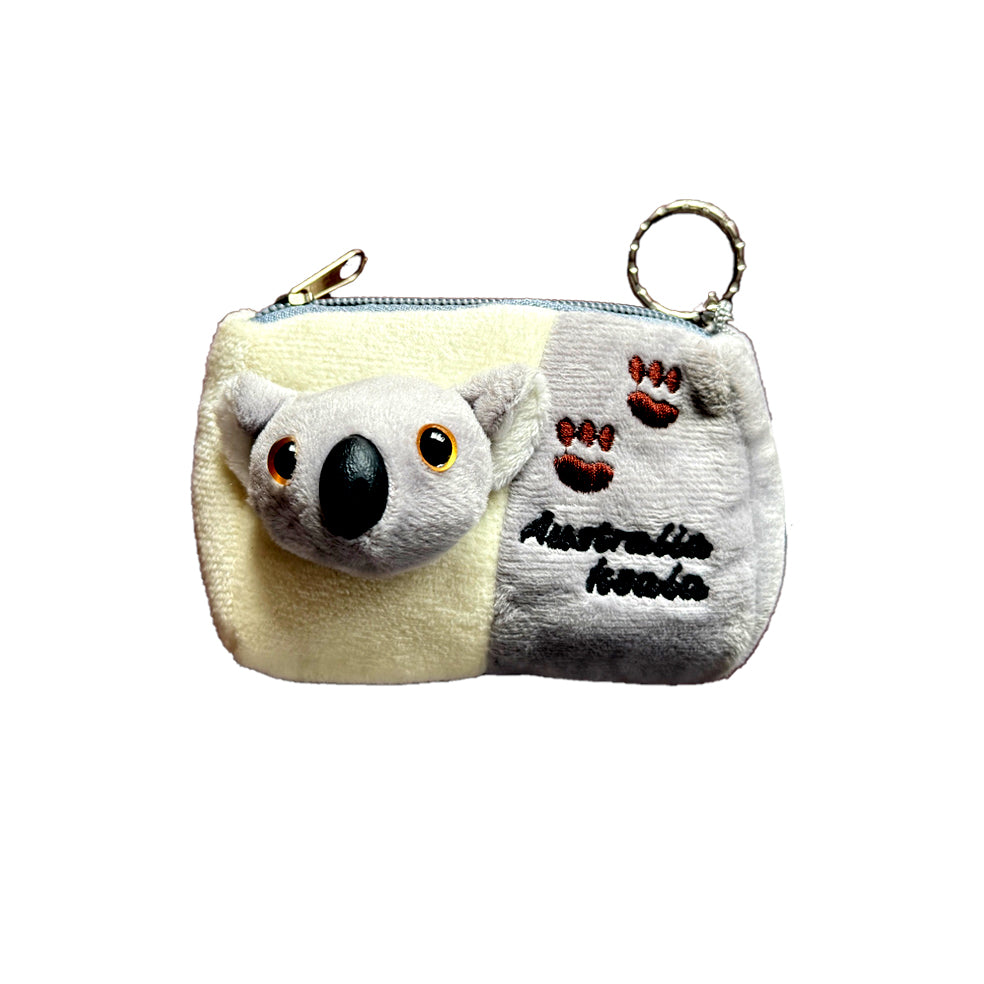 plush fabric material; grey and cream colour block design; 3D koala face with black nose and amber eyes; embroidered paw prints and text; silver zipper with round key ring;