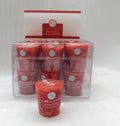 red solid colour votive candle; clear plastic packaging box; round label with text; 10 hour burn time printed; small tapered votive shape;