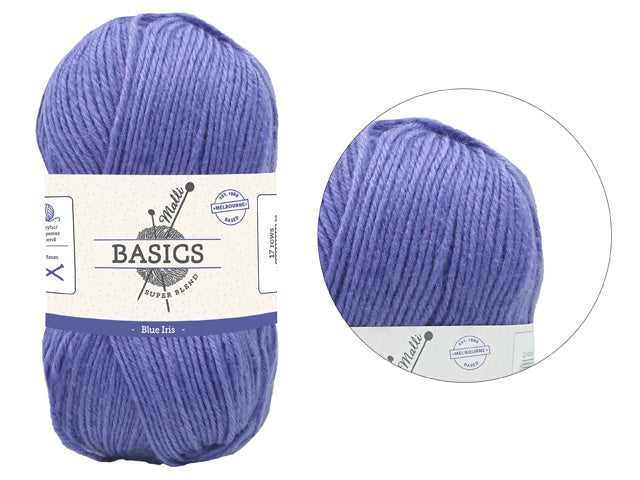 Blue iris colour; Thick, twisted yarn strands; Label with 'Basics Super Blend' text; Oval-shaped yarn skein;