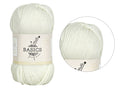 Cream coloured yarn; Soft fibre appearance; Compact yarn ball with label; Label showing 'Basics' and yarn brand;