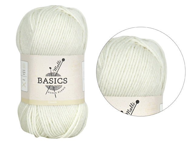 Cream coloured yarn; Soft fibre appearance; Compact yarn ball with label; Label showing 'Basics' and yarn brand;