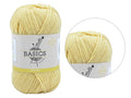 Soft yellow colour; Twisted yarn strands; Label with Basics branding; Compact ball shape;
