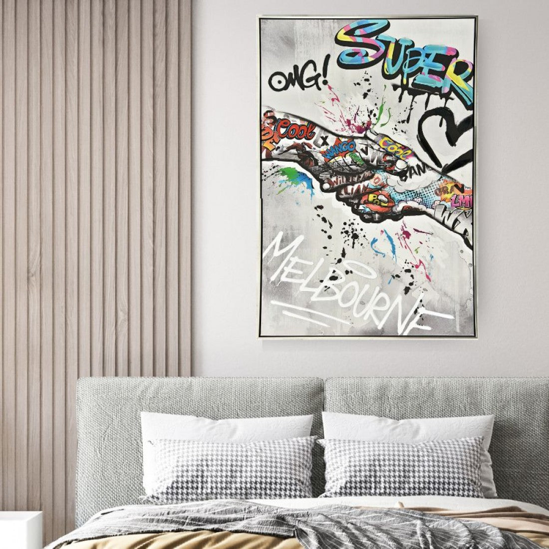 Graffiti style painting with colourful spray paint effect; Silver coloured frame surrounding the artwork; Rectangular shape with dimensions approximately 82.5x122.5x4.5cm; Wall hanging art displayed above a bed in a room setting;