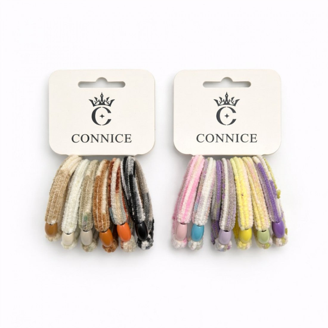 Pack of slim velvet hair ties on branded CONNICE cards; Mixed neutral set with beige, cream, brown and black tones; Mixed pastel set with pink, yellow, lilac and light shades; Each hair tie finished with a small bead at the join;