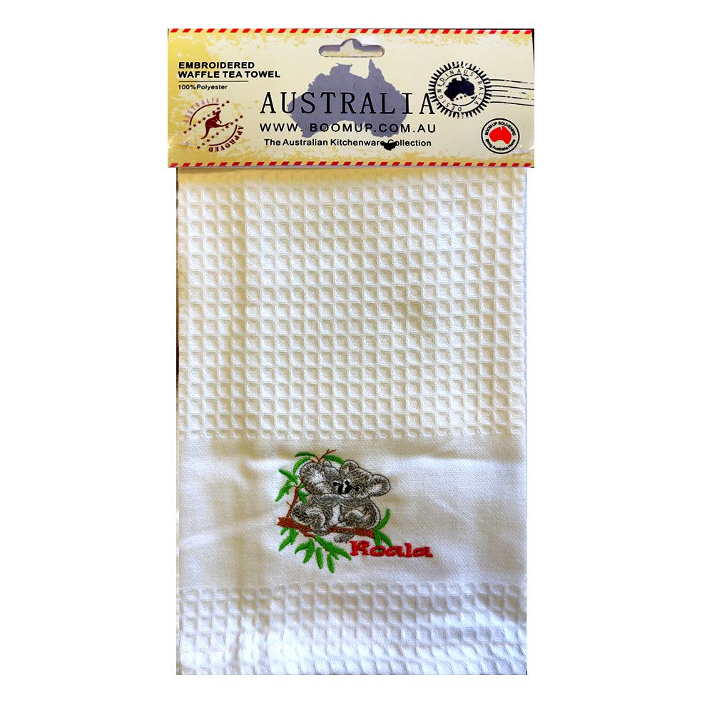 white waffle weave fabric; koala embroidered design in grey and green; red 'Koala' text embroidered; packaged with a header card featuring Australian map;