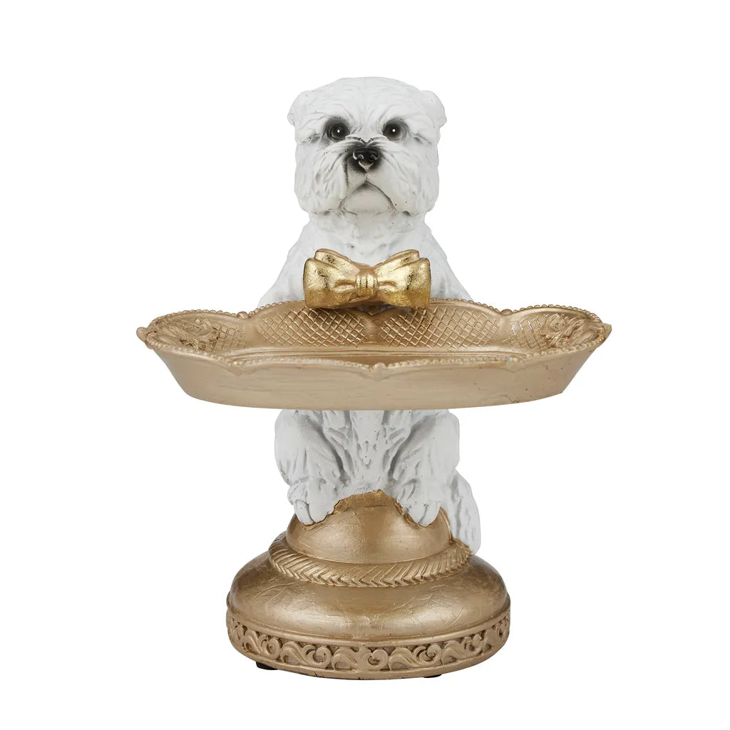 white West Highland Terrier dog figure; gold bow tie on the dog; gold decorative tray held by dog; ornate gold base with texturing; resin material with detailed sculpting;