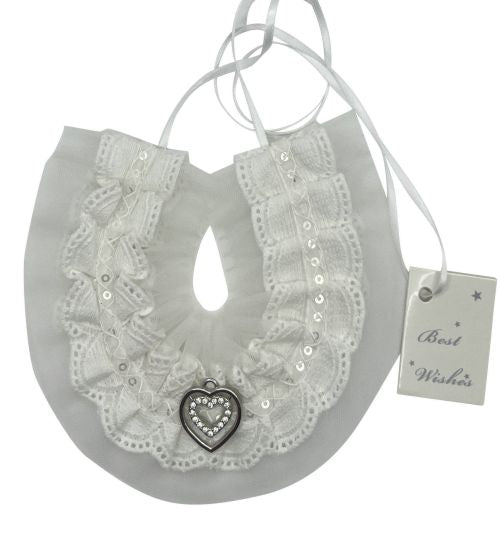 white lace fabric; metallic sequins; circular shape with central hole; silver heart charm attached; white hanging ribbon;