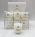 white candle in transparent plastic container; label with white lily scent; pack of 9 candles in clear plastic box; cylindrical votive candle shape;