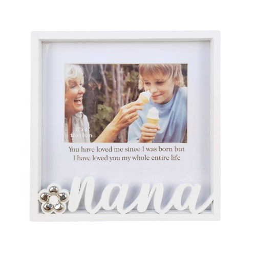 white metal frame; square shape; flower detail decoration; word 'nana' in cursive script; holds 15x10cm photo;