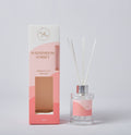 Clear glass bottle with silver collar; White reed sticks included; Pink gradient packaging with gold text; Label reads 'Watermelon Sorbet'; 100ml volume indicated on bottle and box;