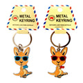 metal keyring with circular ring; kangaroo-shaped charm; kangaroo wears sunglasses; boxing gloves on kangaroo; bright enamel colours;